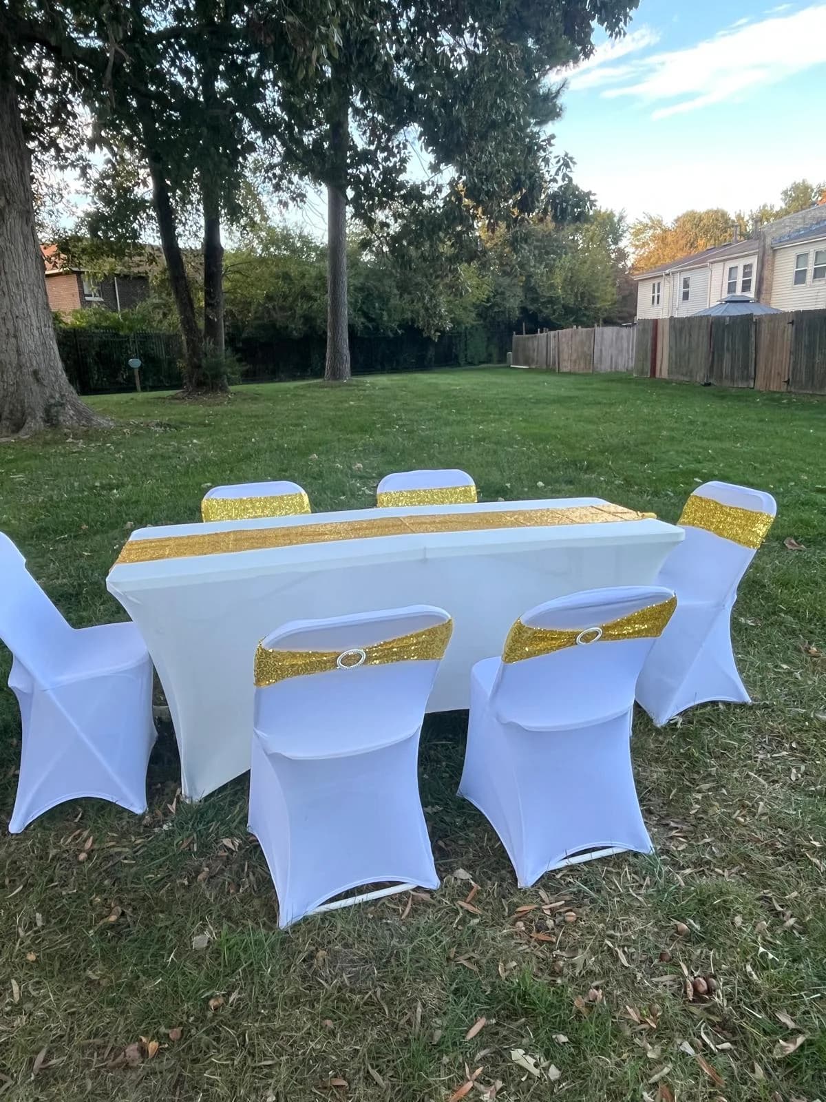 Tables and chairs with gold sequin bands for premium event rental